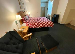 מיטה או מיטות בחדר ב-Hunter Lodge