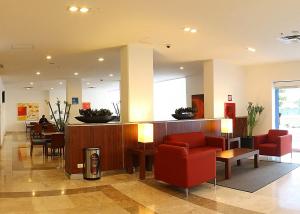 The lobby or reception area at One Ciudad del Carmen Concordia