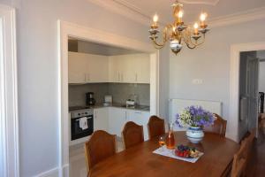 a kitchen and dining room with a table and chairs at Bonjardim 466 - Historic Townhouse in Porto