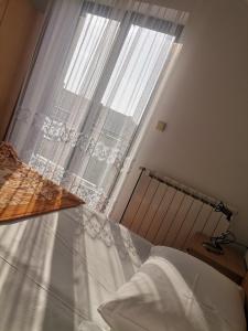 Postel nebo postele na pokoji v ubytování Apartments Petrica