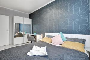 Un pat sau paturi într-o cameră la Vision Apartments Budapest Exclusive