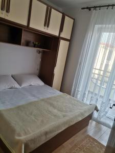 Postel nebo postele na pokoji v ubytování Apartments Petrica