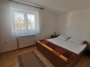 Postel nebo postele na pokoji v ubytování Apartments Petrica
