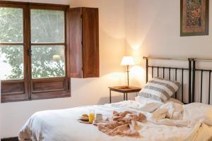 Un pat sau paturi într-o cameră la Hotel Torrontes