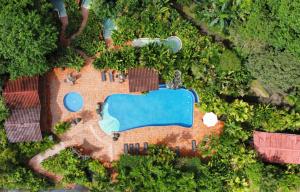 an aerial view of a house with a swimming pool at Casa Luna Hotel & Spa in Fortuna