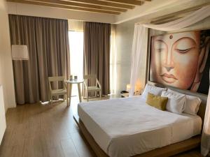 Postel nebo postele na pokoji v ubytování Motel Okura Villas y Suites + 37 fotografií