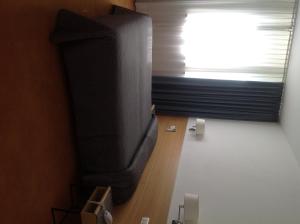 TV a/nebo společenská místnost v ubytování Albergo Al Caminetto