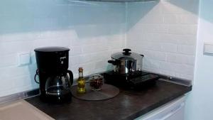 a coffee maker on a counter in a kitchen at Elli S onar in Sykia Chalkidikis