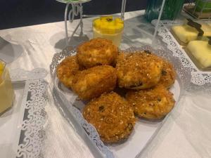 a bunch of donuts on a plate on a table at Holiday Inn Express - Wuhan Optical Valley, an IHG Hotel in Wuhan