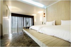 Postel nebo postele na pokoji v ubytování Bari Lamai Resort + 29 fotografií