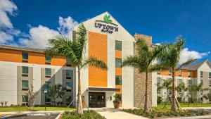 una rappresentazione della parte anteriore di un hotel di Uptown Suites Extended Stay Miami FL – Homestead a Homestead