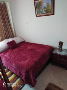 Een bed of bedden in een kamer bij Casa Adelita Paraíso Azul