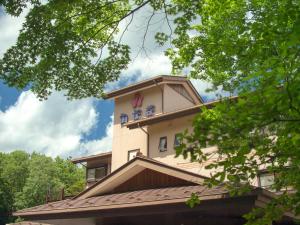 a building with a clock tower on top of it at Jizaiso in Nasu