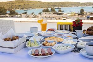 a table with many dishes of food on it at Hola Bodrum in Mugla