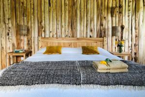 Een bed of bedden in een kamer bij Dream the Days away by Yourhost The Rustic Barn Nanyuki Kenya