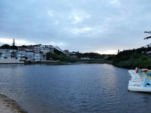 a river with a row of boats in the water at The Courthouse in Ramsgate