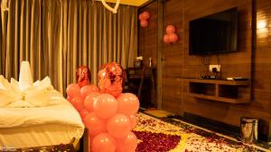a room with balloons and a bed with a bed at The Grand Shekhawati in Rāmsir