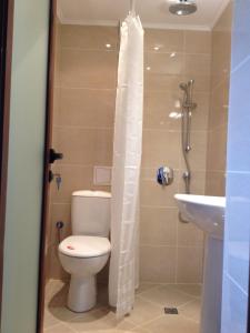 a bathroom with a toilet and a sink at Guest House Balchik Hills in Balchik +38 photos