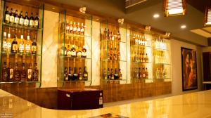 a bar with a bunch of bottles of alcohol at The Grand Shekhawati in Rāmsir