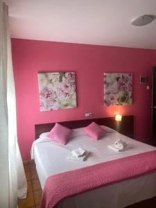 Postel nebo postele na pokoji v ubytování Hostal San Andrés
