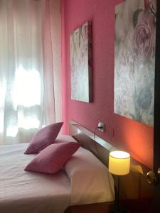 Postel nebo postele na pokoji v ubytování Hostal San Andrés