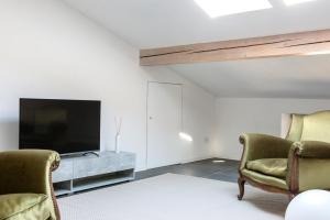 TV a/nebo společenská místnost v ubytování Casa Bano