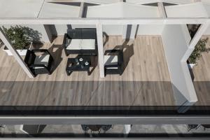 an overhead view of a room with a table and chairs at Morum City Hotel Chania in Chania Town