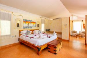מיטה או מיטות בחדר ב-PrideInn Mara Camp & Cottages