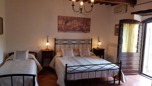 מיטה או מיטות בחדר ב-Casale sul Lago Trasimeno