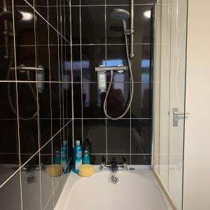a bathroom with a shower and a sink at Lovely 2-Bed Apartment Central Skegness Beach in Skegness