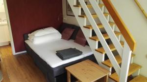 Säng eller sängar i ett rum på Gemütliche Ferienwohnung im Reihenhaus