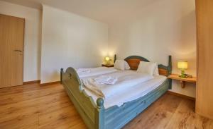 Postel nebo postele na pokoji v ubytování TownHouse Appartements