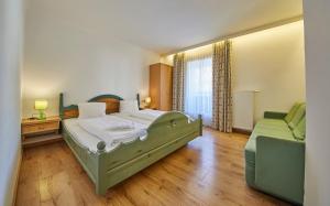 Postel nebo postele na pokoji v ubytování TownHouse Appartements