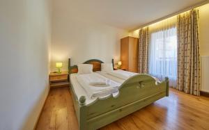 Postel nebo postele na pokoji v ubytování TownHouse Appartements