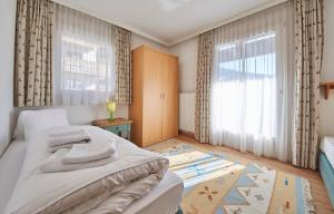 Postel nebo postele na pokoji v ubytování TownHouse Appartements