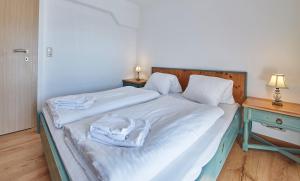 Postel nebo postele na pokoji v ubytování TownHouse Appartements