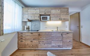 Kuchyň nebo kuchyňský kout v ubytování TownHouse Appartements + 37 fotografií