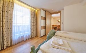 Postel nebo postele na pokoji v ubytování TownHouse Appartements