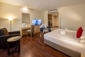 Voodi või voodid majutusasutuse Rocana Hotel toas