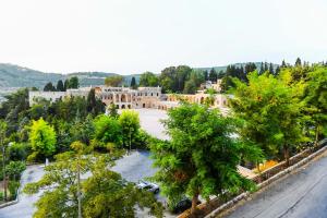 an aerial view of a town with trees and buildings at Beit Lebbos Boutique Hotel in Beït ed Dîne