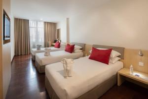 Voodi või voodid majutusasutuse Rocana Hotel toas