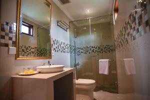 a bathroom with a sink and a shower at Mandox Villa Bali in Ungasan