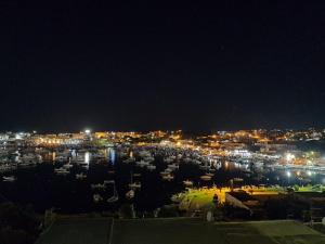 a view of a city at night with lights at B&B Giro Di Boa in Lampedusa