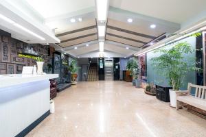 a lobby of a store with potted plants at New Jeju Hotel in Jeju