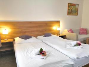 Posteľ alebo postele v izbe v ubytovaní Hotel U Brány