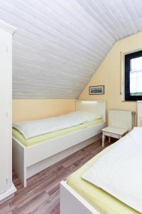 Postel nebo postele na pokoji v ubytování Ferienhaus Lüder