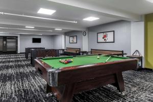 a billiard room with a pool table in it at Quality Hotel & Conference Centre in Edmundston