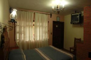Giường trong phòng chung tại Posada de la Salud