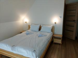 Posteľ alebo postele v izbe v ubytovaní Sowi Kąt - Domki z Baliami oraz Tradycyjne