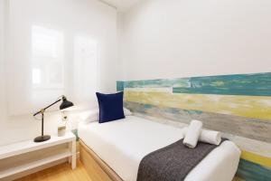 Posteľ alebo postele v izbe v ubytovaní Sitges Group Beach Dreams